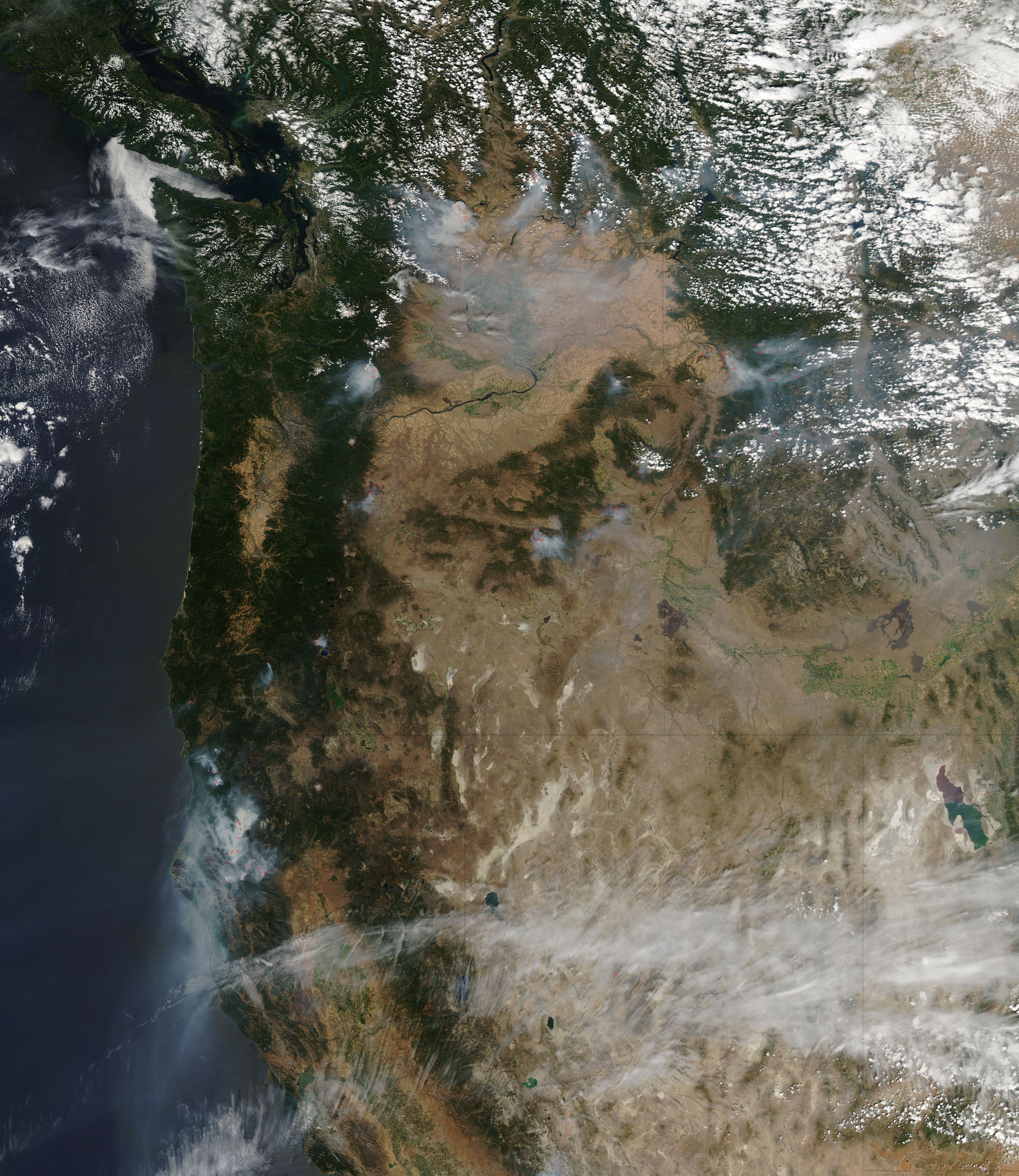 As of August 17, 2015, outbreaks of large wildfires had charred nearly 7 million acres, nearly two million more than the ten-year average through mid-August. This photograph provided by NASA details areas of fire in the Pacific Northwest.