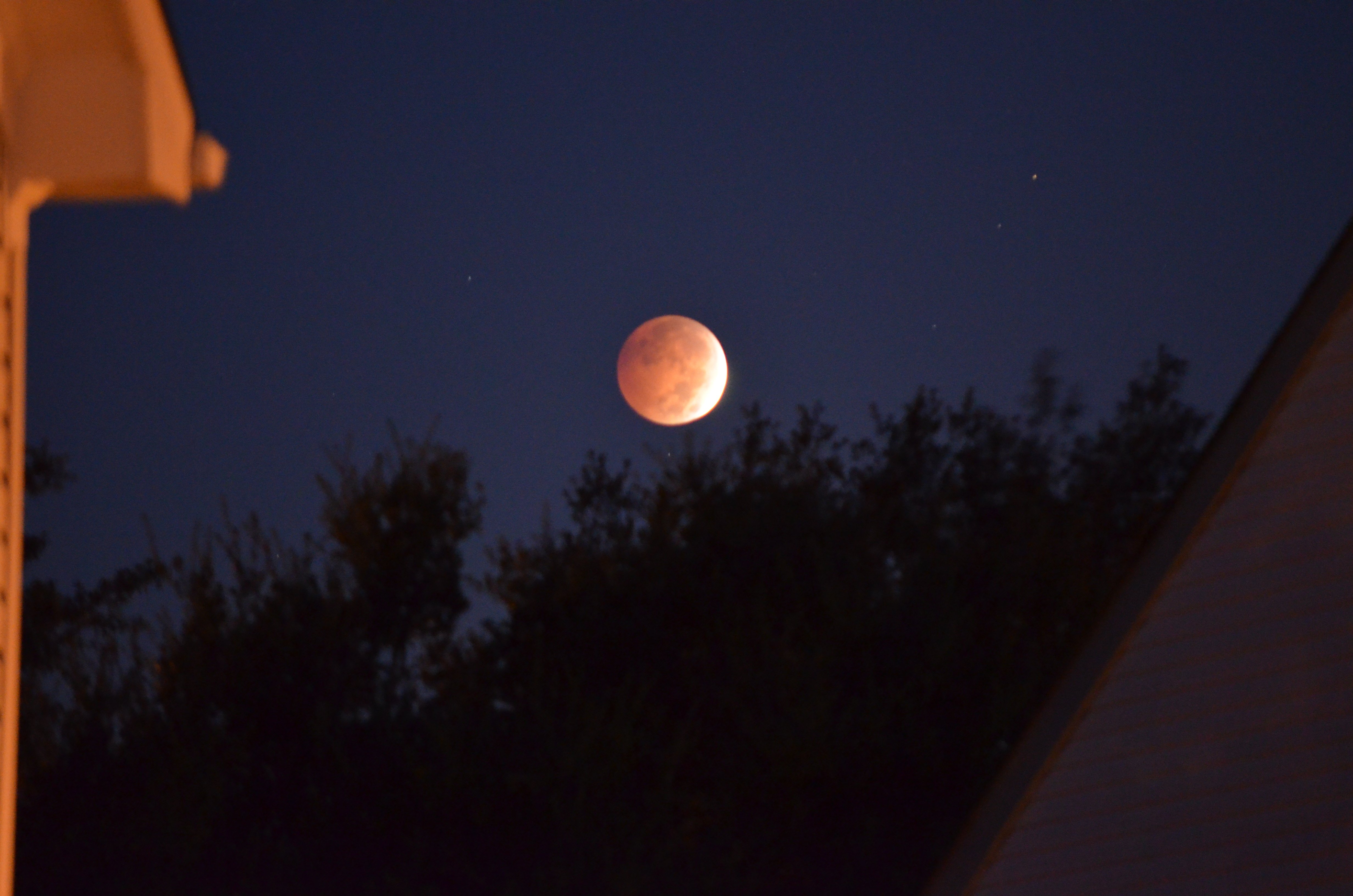 Marie Diaz of Virginia Beach, Virgina took this photograph of the "Blood Moon" lunar eclipse on October 8, 2014. A "Blood Moon" is a dramatic lunar eclipse where the moon appears orange or red due to sunlight scattering off the Earth's atmosphere.