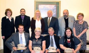 In front, from left to right, are award recipients Matt Gabler, Marcella Jo Lucas, Dan Kohlhepp and Jessica Noland.  In the bac are Chancellor Melanie Hatch with award presenters Nick Suplizio, Sheri Little, Ryan McCombie, Tony Vallone and Jackie Atkins. (Provided photo)