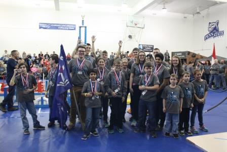 Members of the DuBois Central Catholic Team hoist their trophy in celebration of taking first place in the BEST Robotics Competition at Penn State DuBois on Saturday.  (Provided photo)