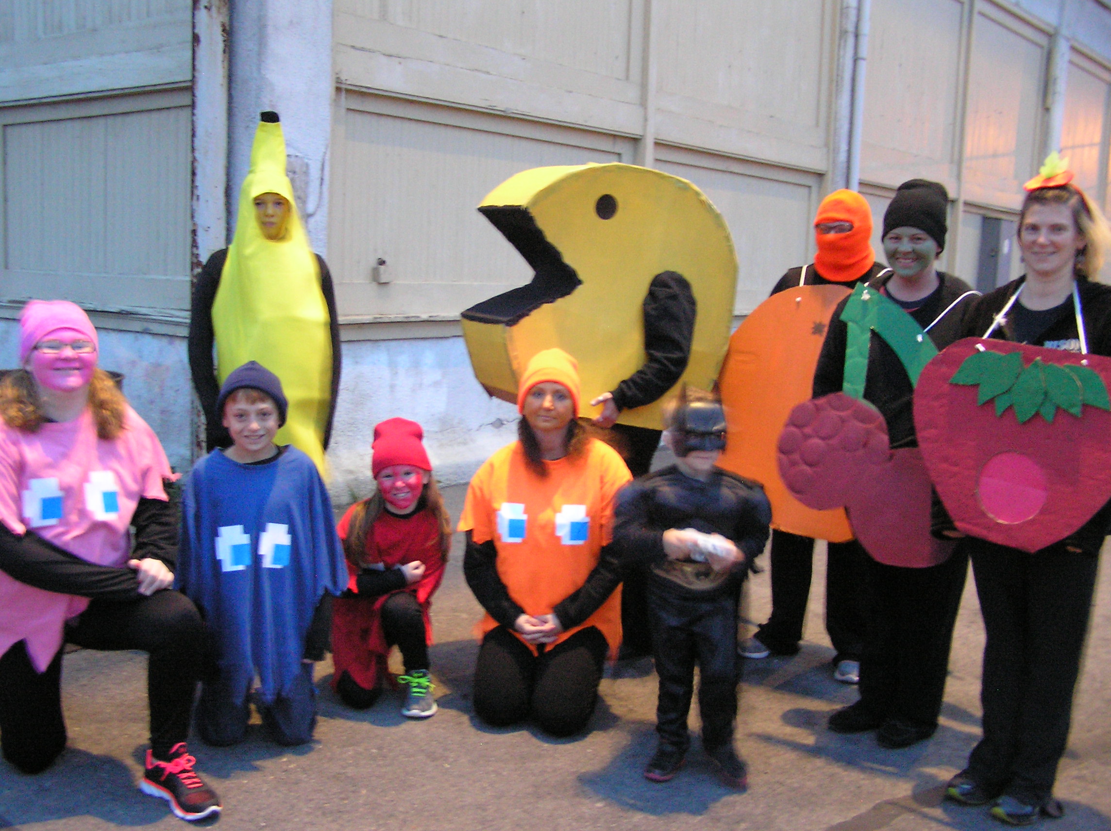 A group of gamers representing  the "Primitive Me" Gift Shop in Clearfield sports a "Pac Man" group costume theme at the annual Halloween Parade Tuesday night. Held by the Kiwanis Club, this year's parade theme was "Hotel Transylvania." Prizes were given for best group costume, best individual costume, best float and for the costume that best captures the parade's theme. (Photo by Kimberly Finnigan)