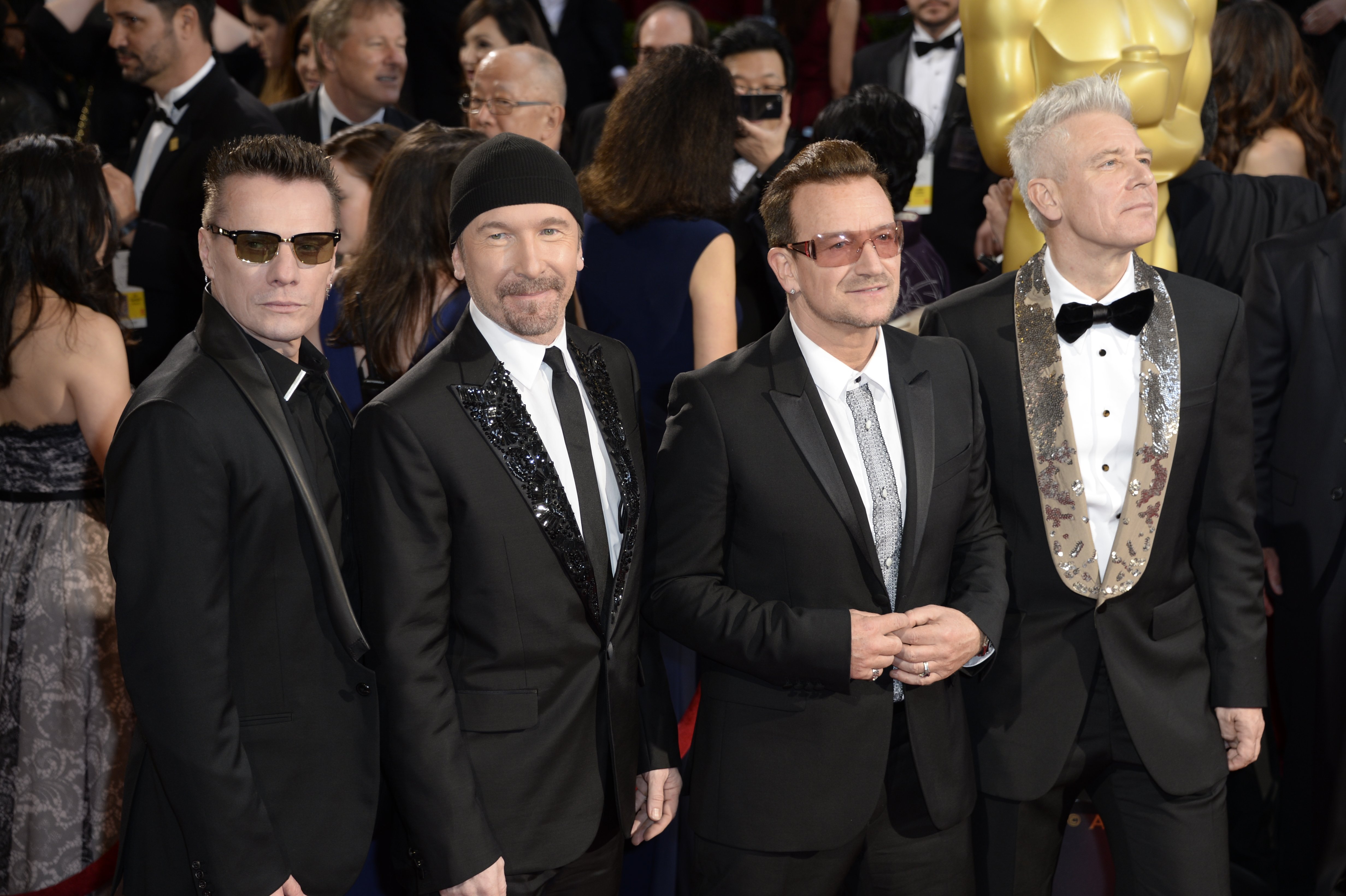 U2 appears on the red carpet at the 86th Academy Awards on Sunday, March 2, 2014 in Los Angeles