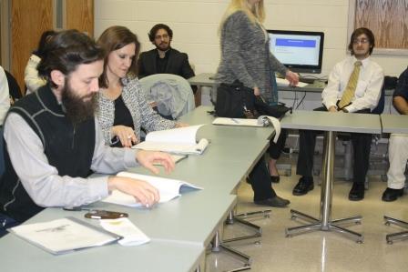 Zeb Bartels, manager of Clarion River Organics, and Senior Instructor of Business Administration Laurie Breakey, review student business proposals during the final class presentation. (Provided photo)