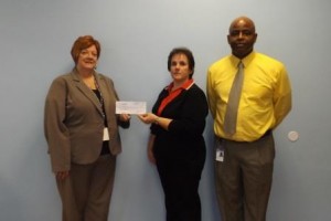 Shown, from left to right, is Cen-Clear’s Chief Executive Officer, Pauline Raab accepting the check from Rosemary Broome representing RMHC and Sean Rockmore, Cen-Clear family community partnership coordinator. (Provided photo)