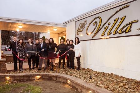 During the ribbon cutting, pictured are Ryan Margolies, Mia Tate (ristorante manager), Casey Murray (villa manager), Renee Snyder, Eddie Tate (owner), Connie Murray, Elise Tate, Carolyn McCracken, Diane Knight, Laurie Young and Jenny Cribbs (catering manager). (Photo by Ryan Haggerty)