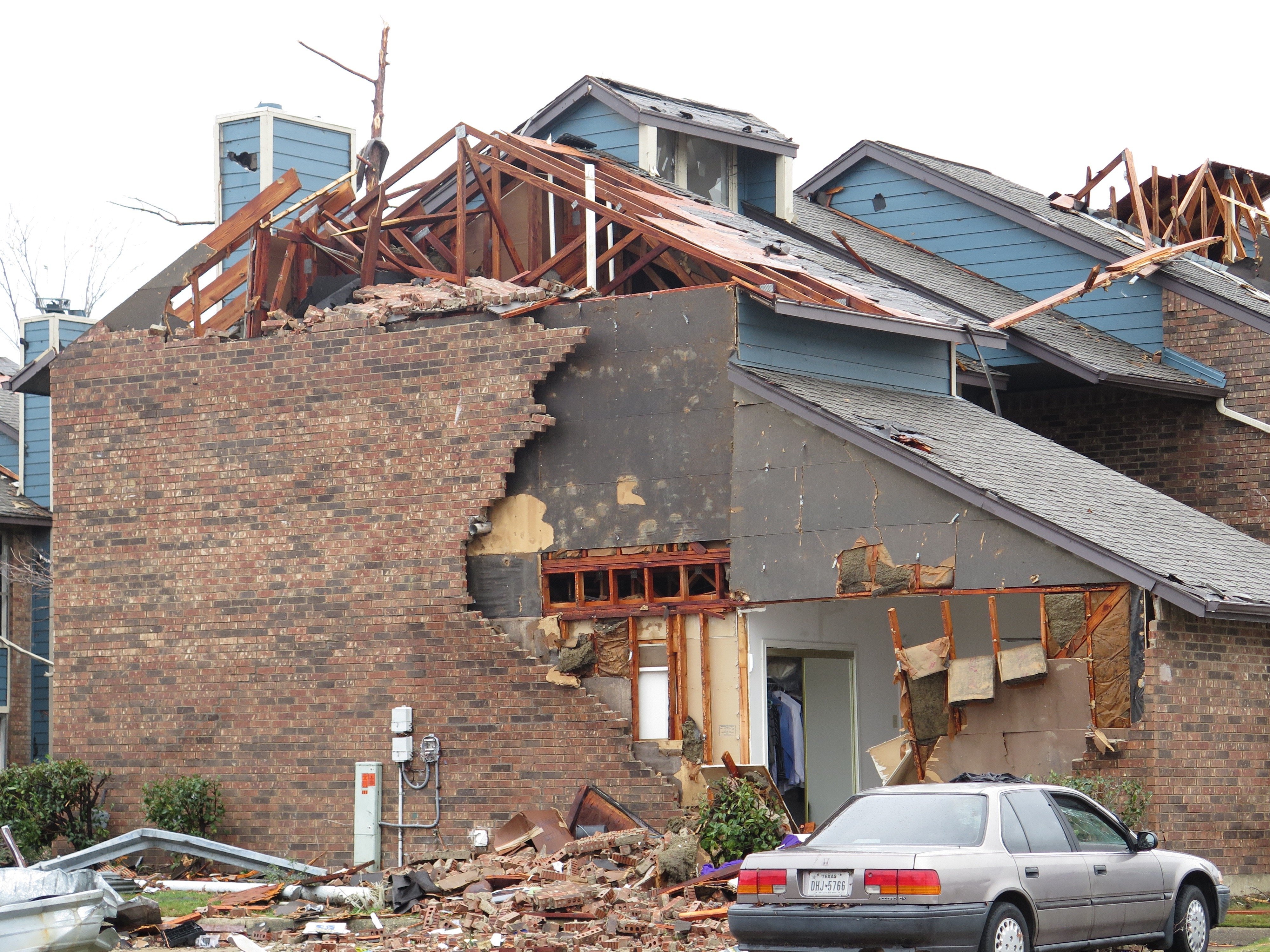 Photos showing damage to the Landmark at Lake Village West Apartments in Garland, Texas