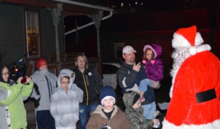 A group of Clearfield Borough residents are greeted by Santa Claus during the Clearfield Volunteer Fire Department's annual Santa Tour on Saturday. The tour started around 5 p.m. and wrapped up shortly after 10 p.m. (Photo by Kimberly Finnigan)