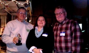 VCC Director Holly Komonczi presented Bill Mackereth and Rick Uren of Pennsylvania Wildlife Habitat Unlimited, a non-profit organization, with the first award for helping the recreation and tourism authority showcase the natural beauty of the area. (Photo by Wendy Brion)
