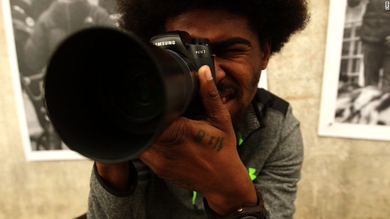 Devin Allen was an amateur photographer when protests began in Baltimore following the death of Freddie Gray. He took many pictures, snapping one that would land on the May 11 cover of Time magazine. Allen has now taken pictures all over the world and runs a youth photography program in Baltimore. He encourages his community to stay focused on creating change in Baltimore.