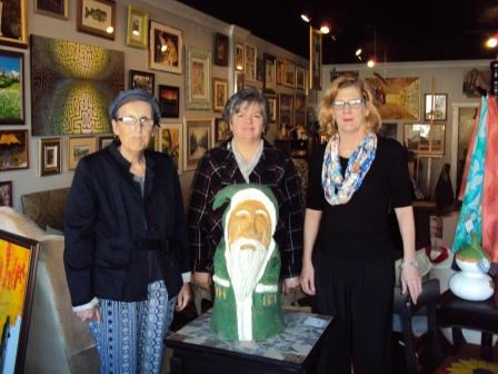 Pictured with the “Hoodie Hoo carving by John Crissman are Jane Lee Yare, Main Street Manager Loretta Wagner and Jody Grumblatt of The Liddle Gallery. (Provided photo)