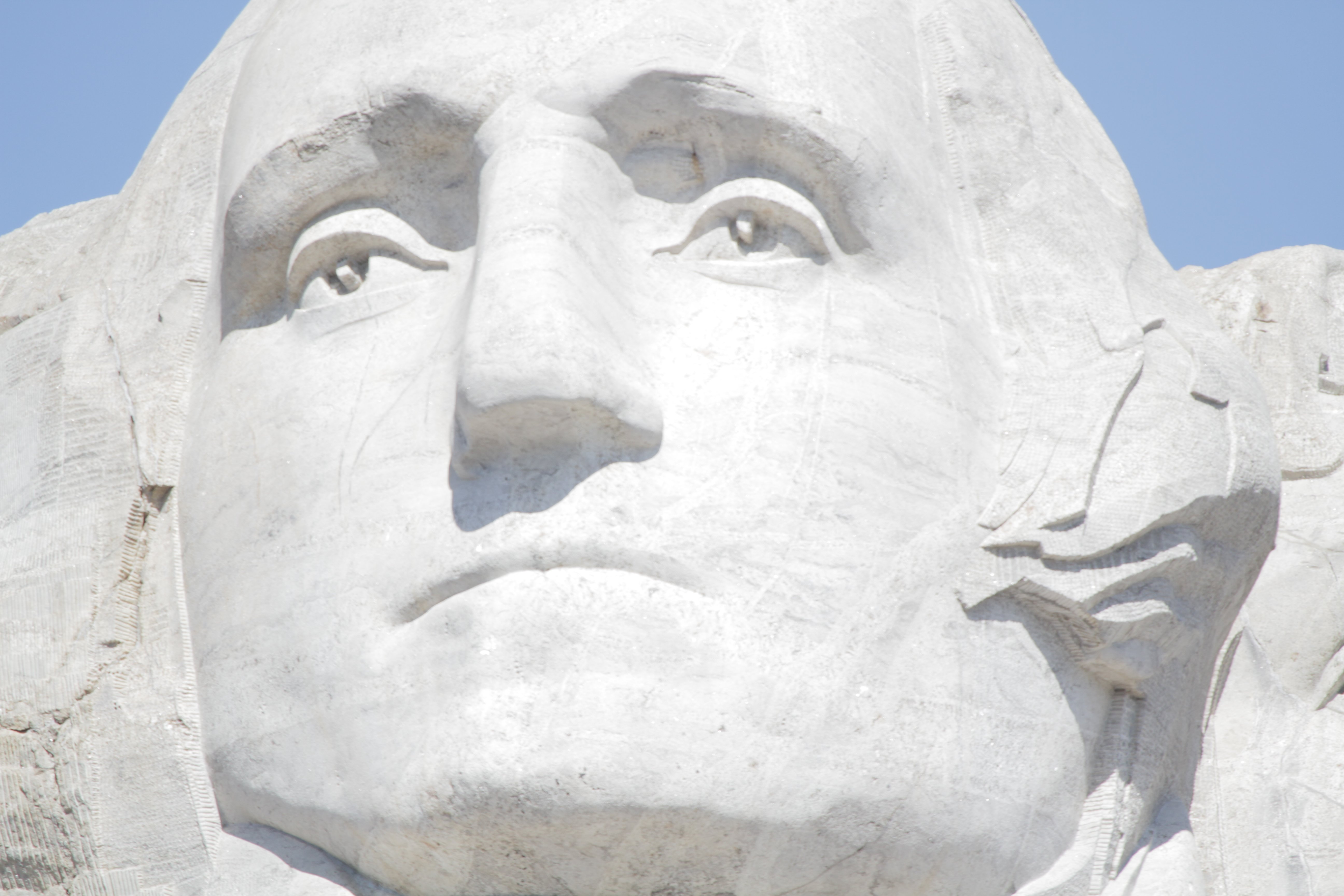 Shots of the Mount Rushmore monument focusing on the George Washington sculpture.