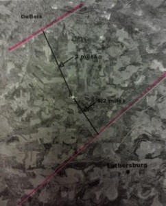 Pictured is a map depicting the area of the proposed disposal injection well on Highland Street Extension. The white dot in the middle is the proposed site and the two pink lines are known fault lines, the top one is two miles away from the site and the bottom one is one-half mile from the site. (Photo by Wendy Brion)