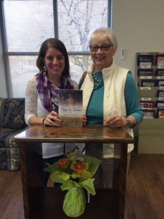 Picture shows Kayla Clark, acting director of Shaw Library on left, with reviewer Pat Bishop (right). (Provided photo)