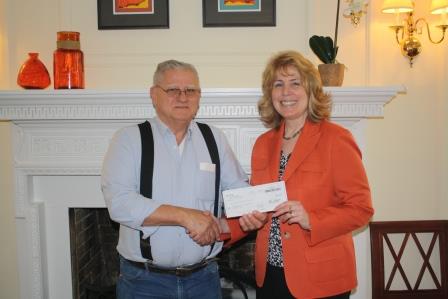 Joe Palumbo, board member for the A.J. and Sigismunda Palumbo Charitable Trust, presents a check to Chancellor Melanie Hatch to support the The Palumbo Scholarship at Penn State DuBois. (Provided photo)