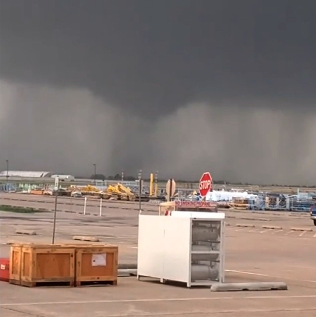 Marc Anthony Bartlett took this near Tulsa International Airport showing a tornado forming in the distance.

https://www.instagram.com/p/BDmOiR-jWag/