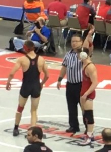 Luke McGonigal gets his hand raised after his consolation round win