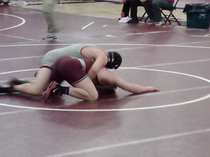 Bison Travis Ogden rides out State College's Cory Dreibelbis to secure the 3-0 victory (Photo by Jay Siegel)