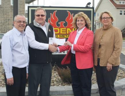 From left are Phoenix Sintered Metals Community Initiatives Coordinator Nick Hoffman and Chief Operating Officer Steve Leuschel presenting a check to Penn State DuBois Chancellor Melanie Hatch and Director of Development Jean Wolf. (Provided photo)