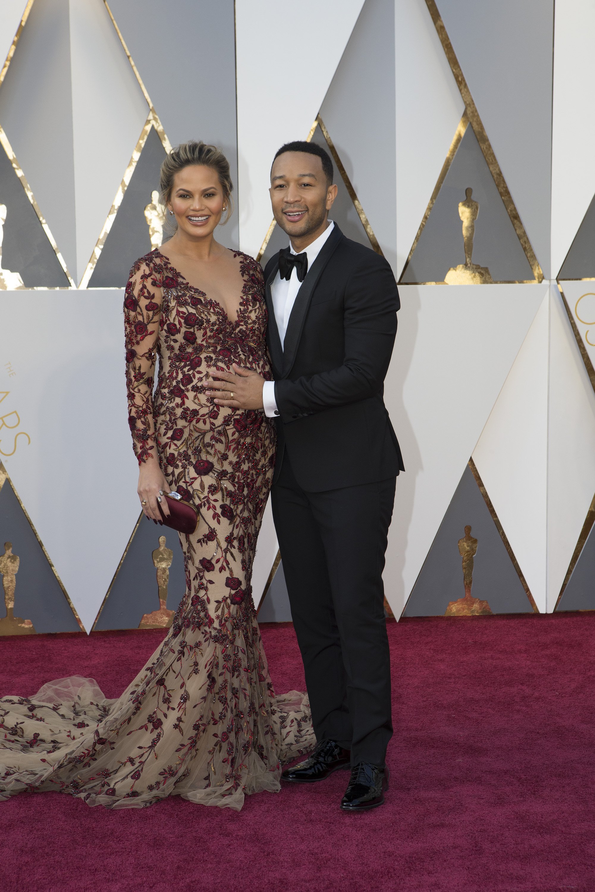 Chrissy Teigen & John Legend arrive at the 88th Academy Awards on Sunday, February 28.