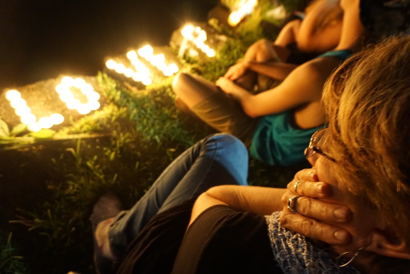 Community members mourn together to remember the lives loss at Pulse night club on Sunday, June 12th in Orlando, Florida.