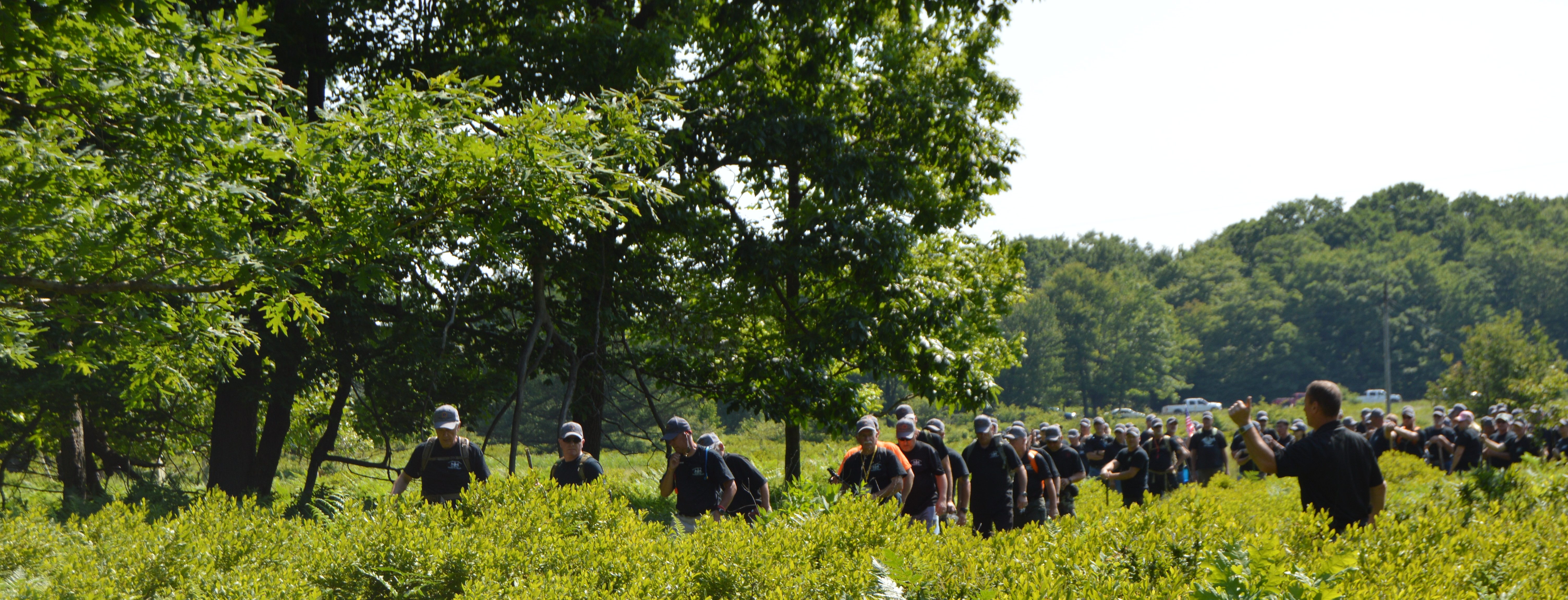 About 187 members of the Clearfield County Sheriff's Posse move through the brush during a mock search exercise Saturday near the Greenwoos Club on the outskirts of Curwensville. The exercise was designed to give the posse members real-life experience of what they will be required to do if they are ever deployed for an actual search. Sheriff Wes Thurston said the exercise was a success and the missing person, a 7-year-old girl, was located within 30 minutes of the start of the search. (Photo by Kimberly Finnigan)