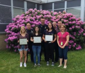 Pictured, from left to right, are DuBois winners: Ali Martini (third place), Erin Wilderoter (first place), Gabby Buckley (second place) and Denise Delp, English teacher. In back are: DuBois City Police Corporal Matt Robertson, Officer David Tracy, Officer Paul Brosky and Assistant Principal Brian Mullhollan. (Provided photo)
