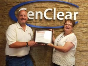 Chris W. Hovanec, senior engineering specialist with FM Global, presents a fire prevention grant award to Judy Patterson, nutrition/safety advisor with Cen-Clear. Funds will be used to support the agency’s Project Fire FLIES (Fundamental Lessons in Every Site) safety education program. (Provided photo)