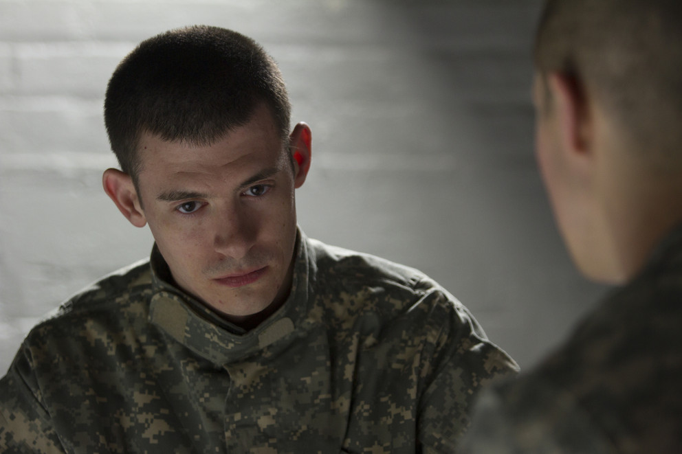 Depressed soldier being consoled by peer