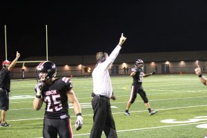 Head coach Tim Janocko signalling for the extra point following what ultimately was the game-winning touchdown.