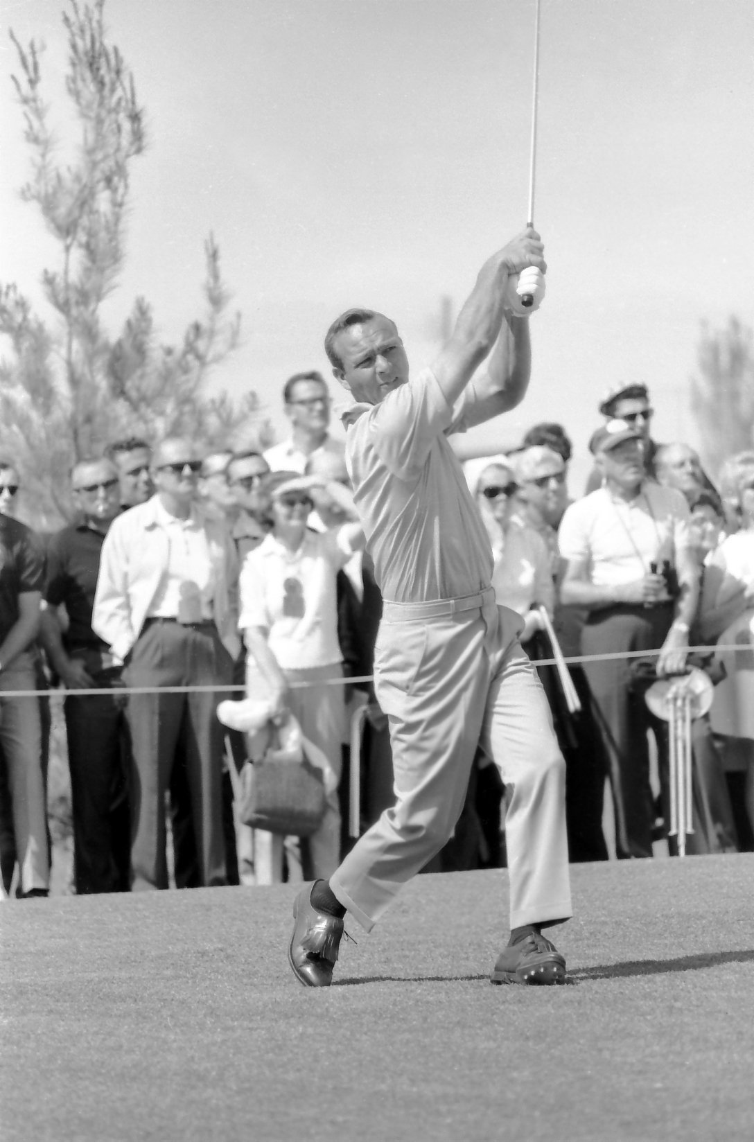 Arnold Palmer receives his winnings in silver dollars at the 1965 Tournament of Champions golf tournament at the Desert Inn Country Club in Las Vegas.