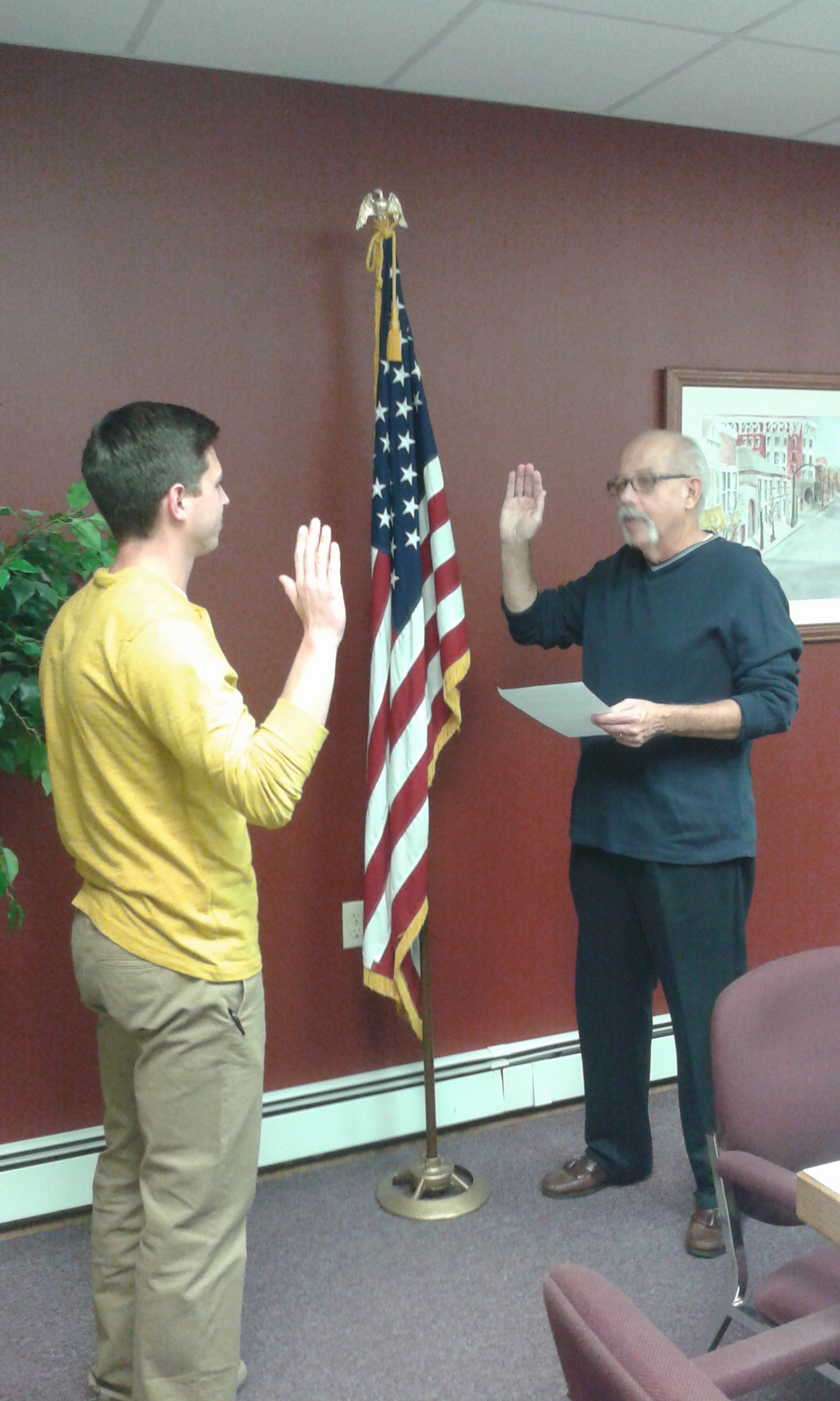 Robbie Tubbs, newly appointed member of the Clearfield Borough Council, takes the oath of office as administered by Major James Schell Thursday at the regular Clearfield Borough Council meeting. Tubbs was appointed to fill the Second Ward council seat which had been vacated following the death of Council member Dave Gallaher in September. (Photo by Kimberly Finnigan)