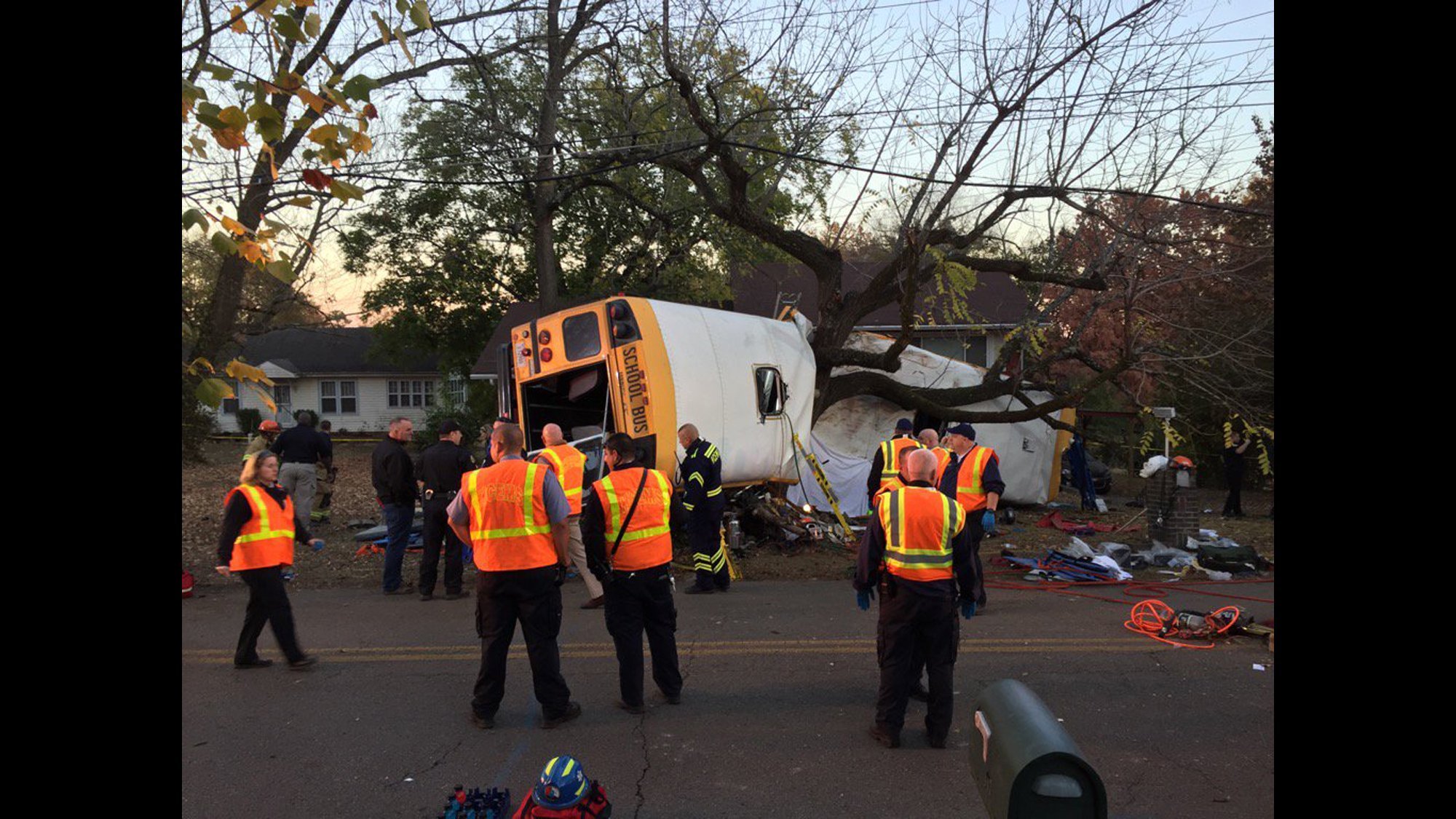 Medics rushed nearly two dozen people to hospitals in Chattanooga on Monday after a school bus crashed in the Tennessee city, officials said. The bus appears to have slammed into a tree and looks like it was split apart.