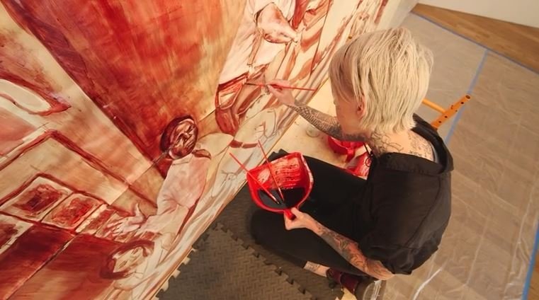 Illma Gore caused quite a controversy during the presidential campaign last year with her illustration depicting a nude Donald Trump. This time she's teamed up with an artist collective to create a mural using human blood.