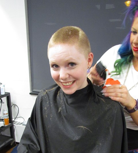 Student Amber Metzger goes under the shears to have her head shaved for the THON Hair Auction. Metzger brought in $2,550 in donations for the cause.  (Provided photo)