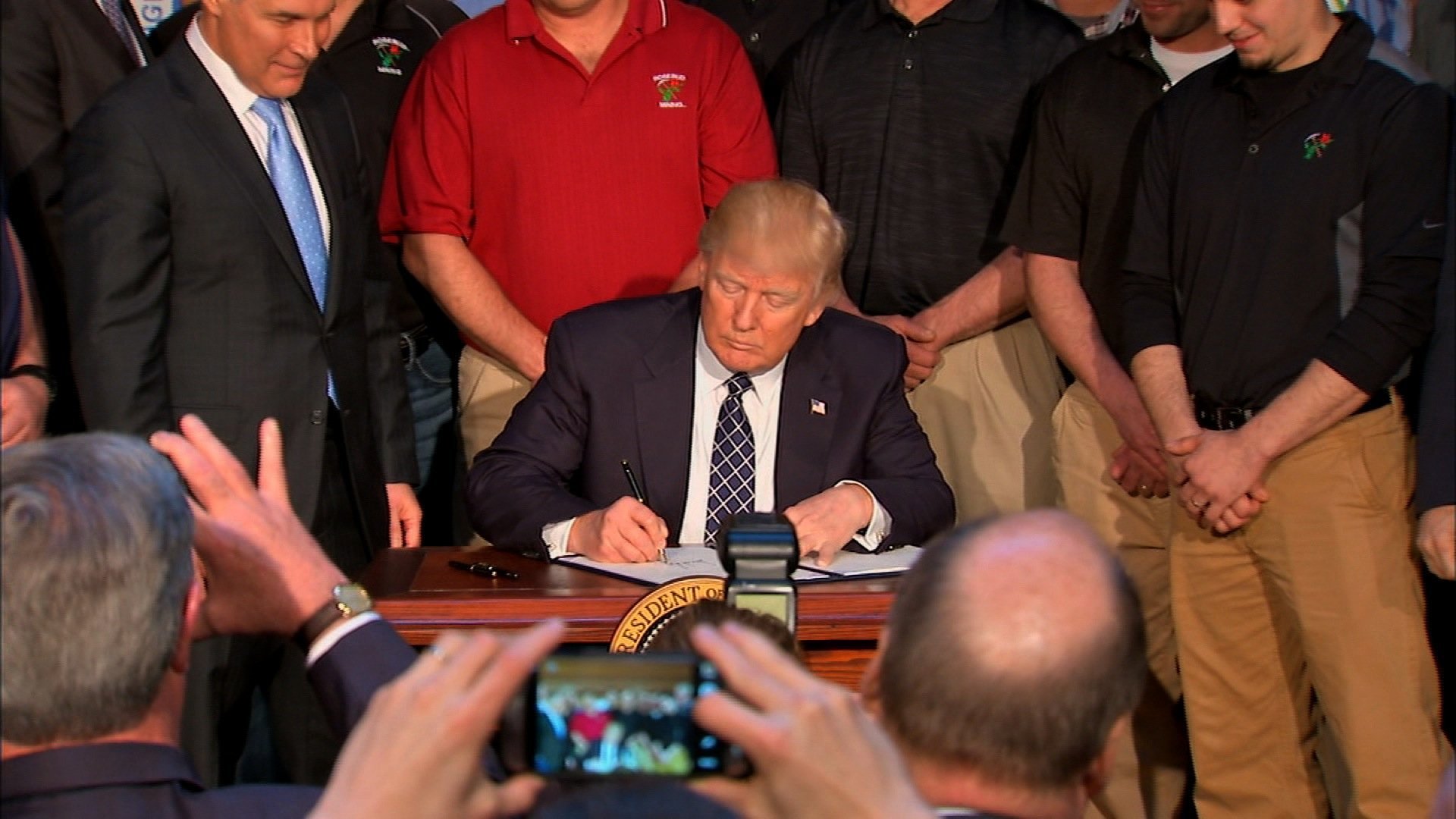 President Donald Trump signs his executive order on climate change on March 28, 2017.