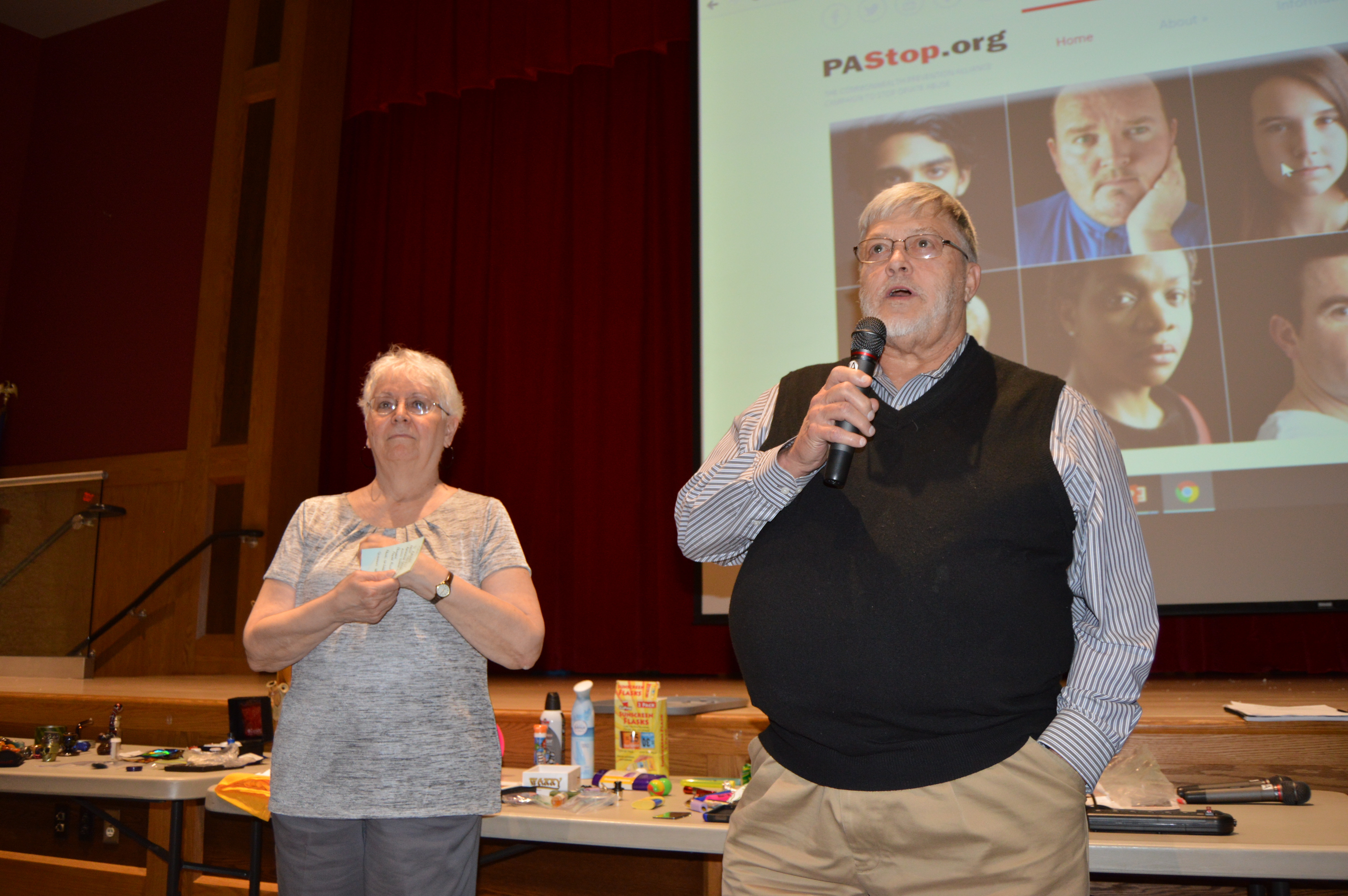 Clearfield Area School Board members Mary Anne Jackson, left, and Larry Putt, right, introduce members of a panel during Wednesday's drug and alcohol forum at the Clearfield Area Junior-Senior High School. The school board invited members of the Clearfield/Jefferson Drug and Alcohol Commission, the Clearfield County Coroner's Office, Clearfield EMS, Clearfield Borough and Lawrence Township Police Departments, the Clearfield County Probation Office and the Clearfield County District Attorney's Office to speak about trends in drug and alcohol abuse among school-aged children in Clearfield County (Photo by Kimberly Finnigan)