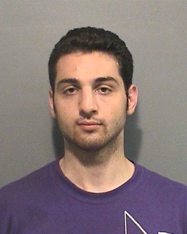 The photos of Tamerlan Tsarnaev were taken by the Cambridge PD in 2009 after his arrest on an assault charge. Tsarnaev died amid an explosive firefight in nearby Watertown after he was run over by an SUV driven by his brother. Dzhokhar Tsarnaev was arrested and convicted of carrying out the bombings, and he was sentenced to death in 2015.