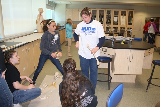 Lola Smith, instructor of anatomy and physiology at Penn State DuBois, instructed girls in the Math Options program in a workshop that highlighted ways the study of anatomy can be used in forensic science.  (Provided photo)