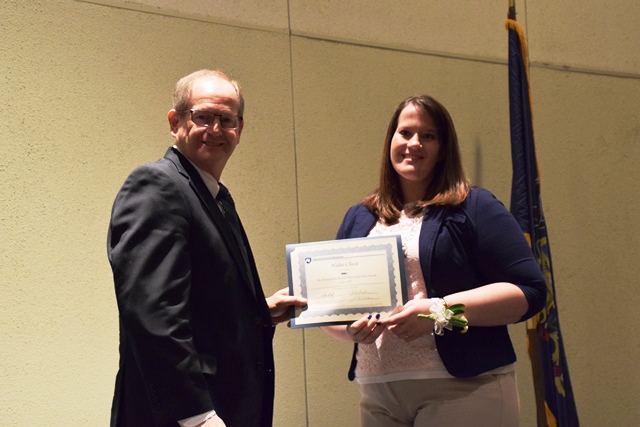 Halee Kephart Chase of Brisbin was presented with a certificate of graduation by Dr. Dennis Calvin, associate dean and director of Penn State Extension. (Provided photo)