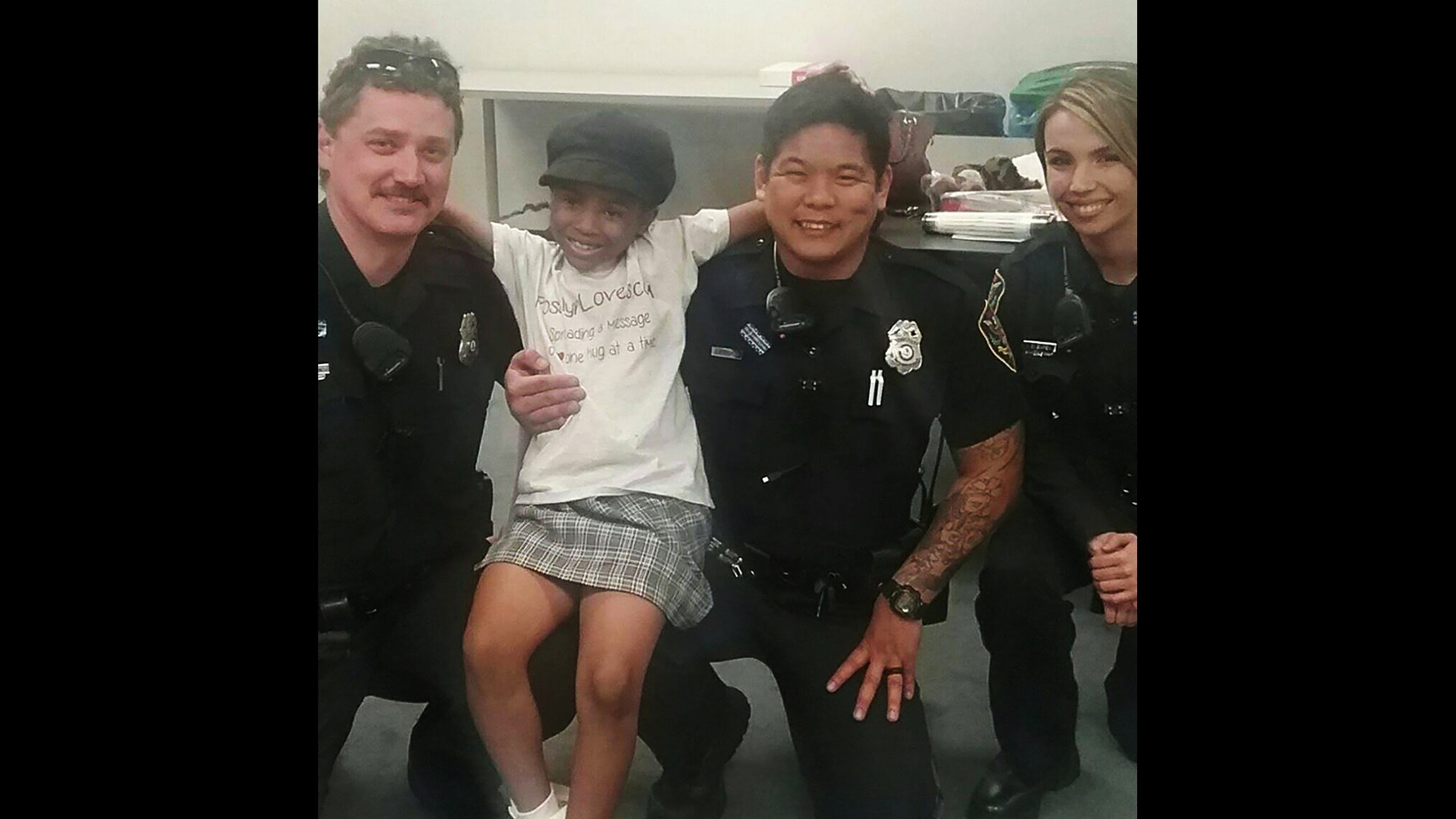 Rosalyn Baldwin, 7, with officers from Roanoke Police Department in Virginia.