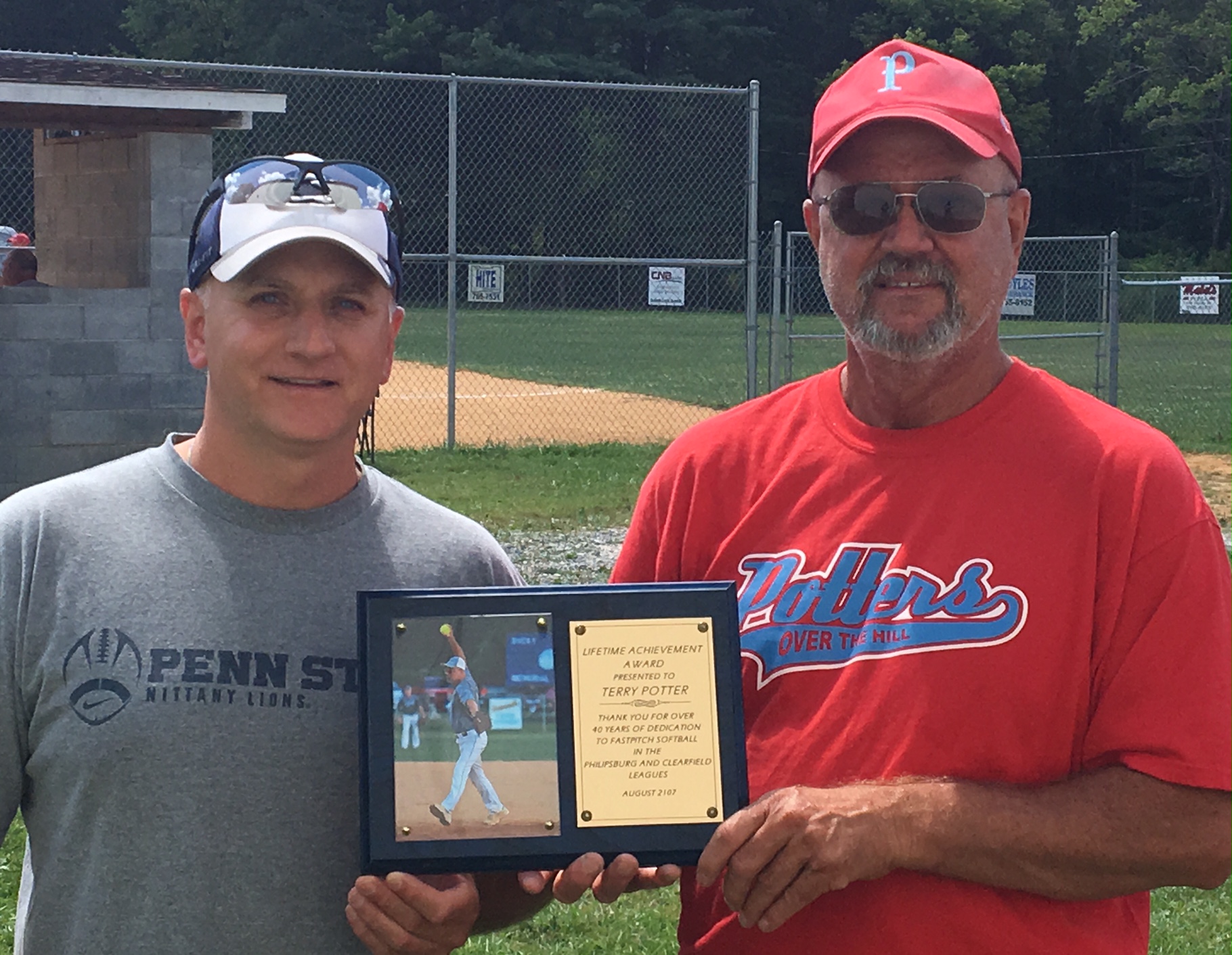 Terry Potter (right) is pictured with his Lifetime Achievement Award and committee member Dave Patrick (Photo by Jay Siegel)