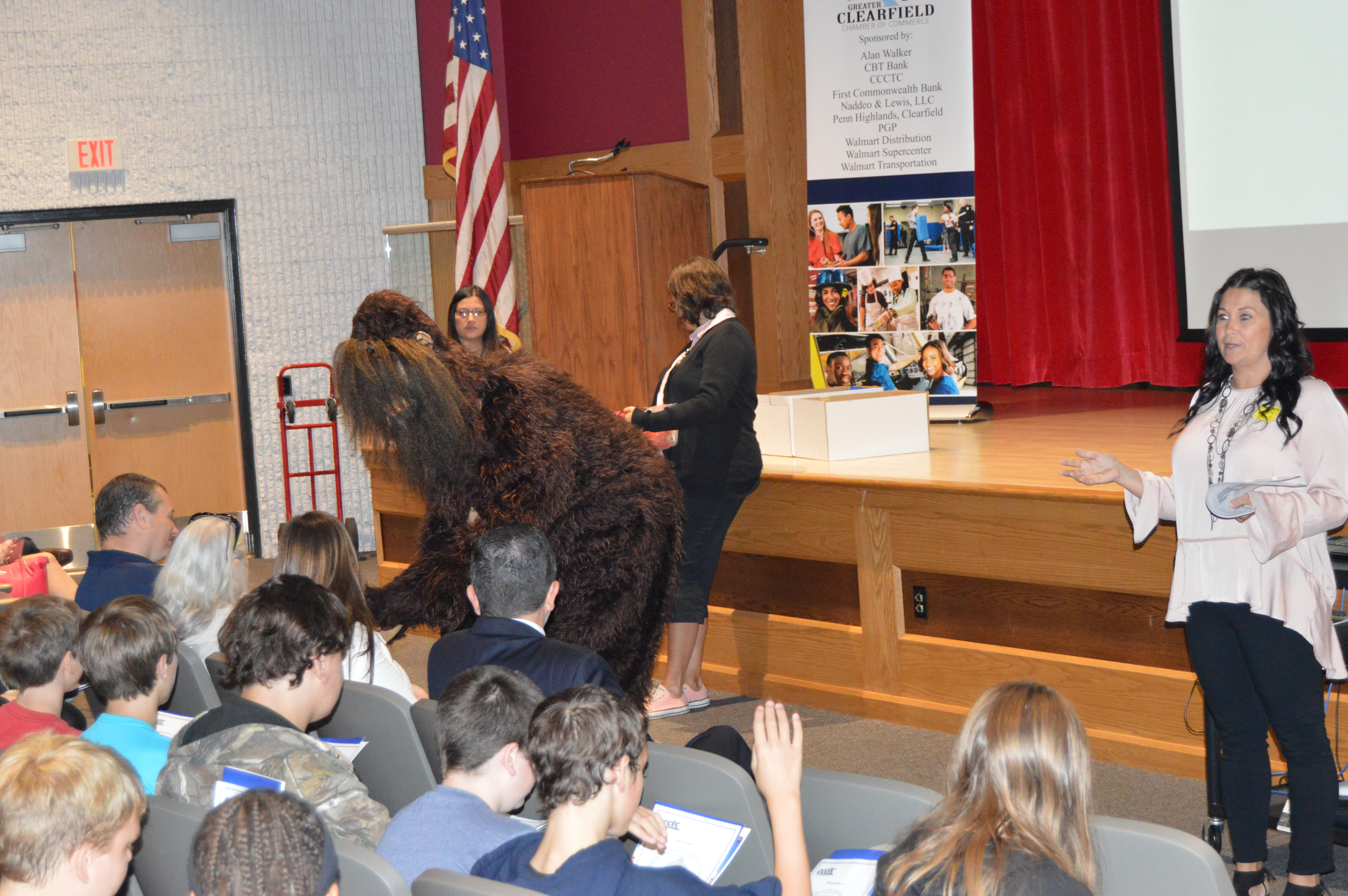 "Sasquatch," the mascot of the Clearfield County Career & Technology Center, greets eighth grade students at the Clearfield Area Junior-Senior High School. 
The Sasquatch was on hand as part of the Exploring program held Monday at the school. 
The program, being held by the Greater Clearfield Chamber of Commerce and various local business partners, is designed to help the students learn about careers right here in the Clearfield area. 
(Photo by Kimberly Finnigan)