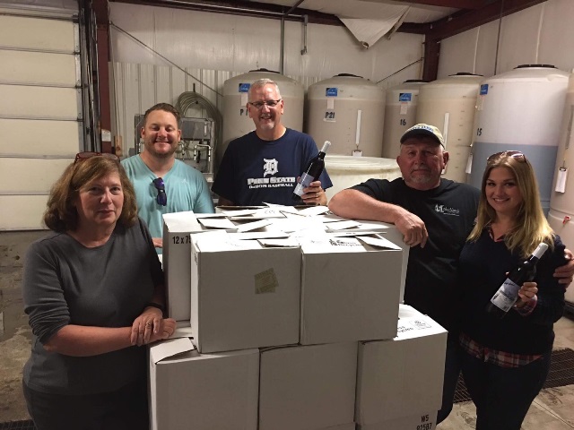 Making wine in support of Penn State DuBois athletics are, left to right: Terri Mathews, Jeff Gasbarre, Mike Nesbit, Chip Mathews and Jen Young. (Provided photo)