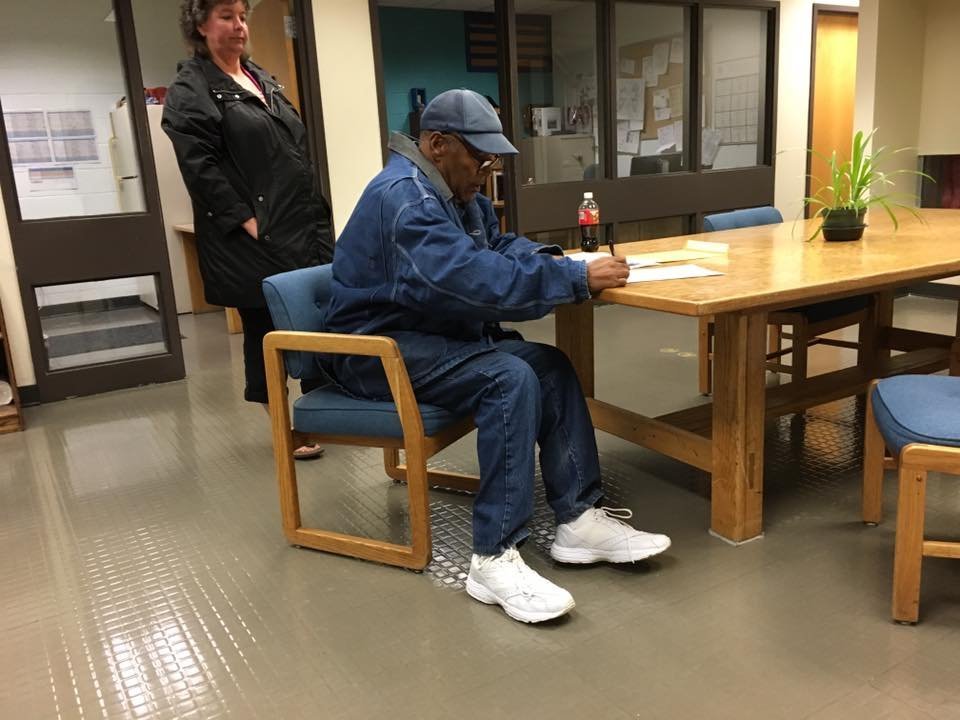 O.J. Simpson signs paperwork before his release from prison on Sunday, October 1, 2017.