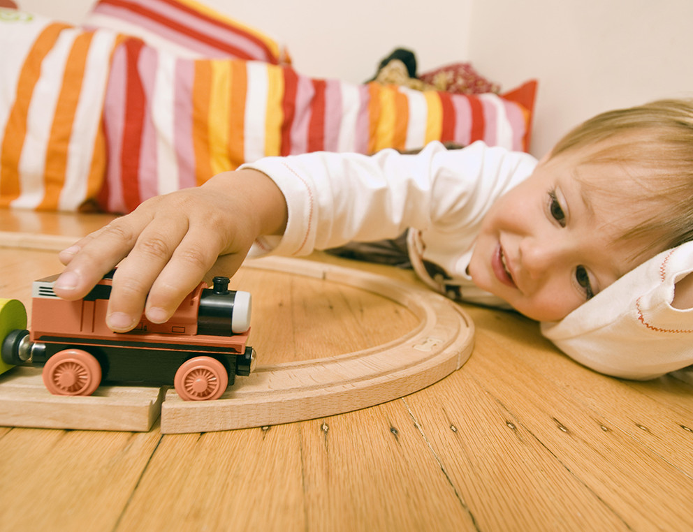 Boy playing with toy train