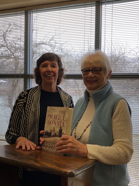 Gwen Crandell (on left) introduces Pat Bishop, who reviewed the book Prague Sonata by Bradford Morrow at this week's Books Sandwiched-In program at Shaw Public Library. (Provided photo)
