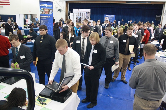Jobseekers interact with employers during last year's career fair in the campus gymnasium.   (Provided photo)