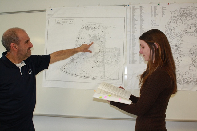 Professor Rob Loeb and graduate Taylor Walborn revisit the maps and documents used during their urban forest research project conducted when Walborn was a student at Penn State DuBois. The results of their research appear in this month's issue of  the Journal of the Torrey Botanical Society. (Provided photo)