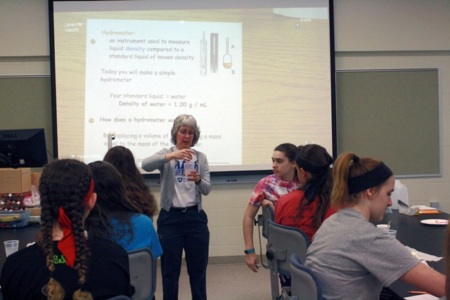 Presenter Sue Swope, an adjunct instructor in chemistry at Penn State DuBois, instructed girls in making a simple hydrometer during her workshop. Hydrometers are used in work with chemistry and other applications to measure the density of liquids.  (Provided photo)