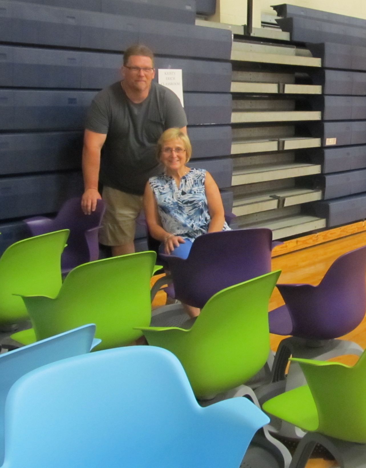 Elementary Principal Carol Bernat (seated) checks out one of the new elementary student chairs before Ken Coder, director of maintenance, and his crew begin moving them to their new location.  Multiple classrooms at DuBois Central Catholic will be fitted with new student furniture before the start of the new school year, thanks to a Palumbo Foundation Grant, supporting Central’s ‘Classrooms of the Future’ initiative.    (Provided photo)
